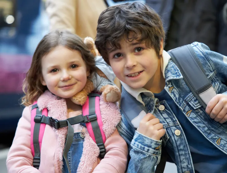 Girl and boy outside train Hull Paragon station