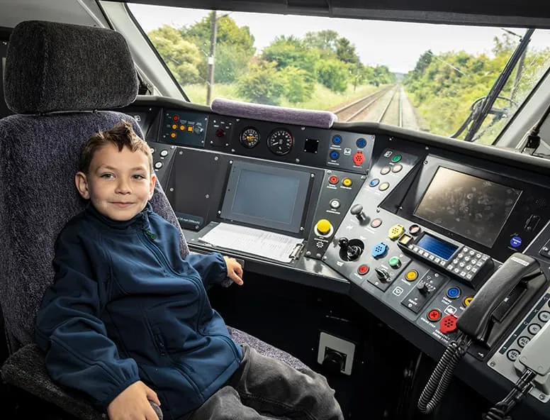 Tyler sat in the drivers cab onboard a Hull Trains service