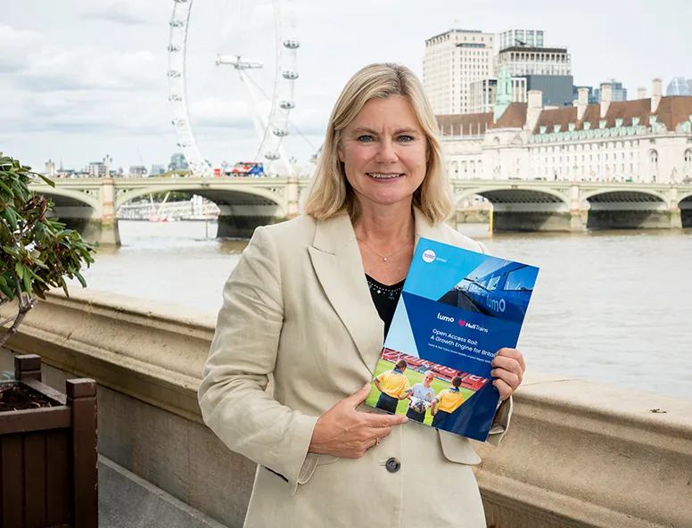 A photo of Justine Greening holding the Hull Trains and Lumo report